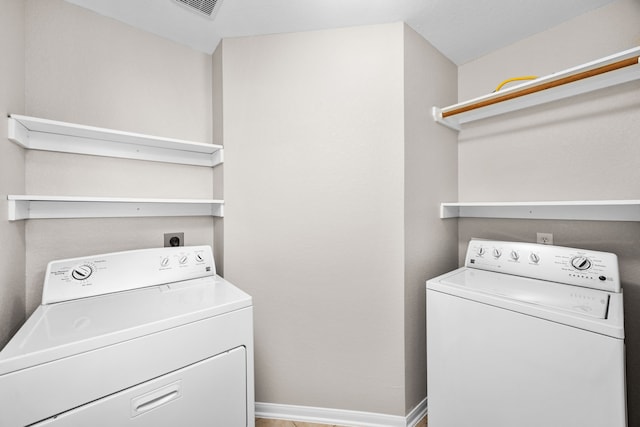 21002 Pineda Cir, Richmond, TX 77406 - laundry area with washer and clothes dryer