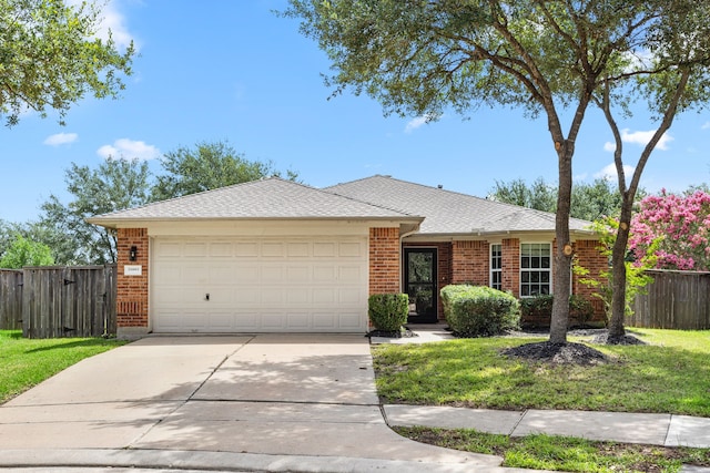 21002 Pineda Cir, Richmond, TX 77406 - ranch-style house with brick siding, an attached garage, driveway, and roof with shingles