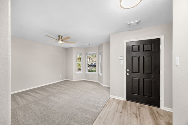 21002 Pineda Cir, Richmond, TX 77406 - foyer with ceiling fan and wood finished floors