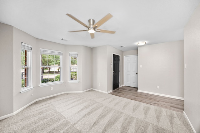 21002 Pineda Cir, Richmond, TX 77406 - spare room featuring carpet and a ceiling fan