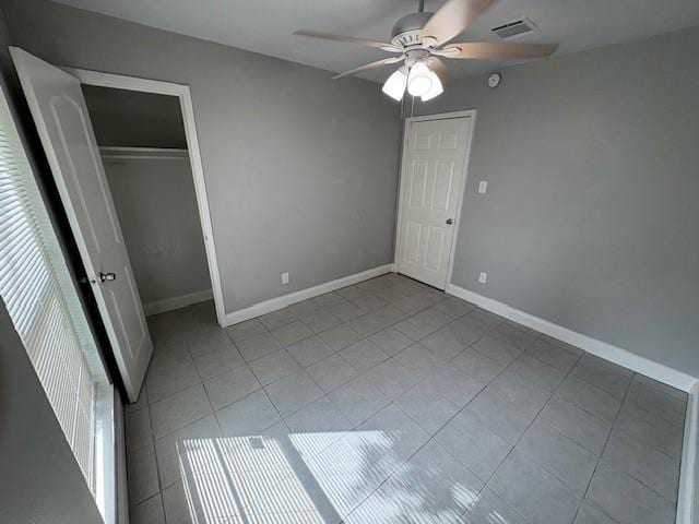 12127 Rhinebeck Dr, Houston, TX 77089 - unfurnished bedroom featuring tile patterned floors, ceiling fan, and a closet