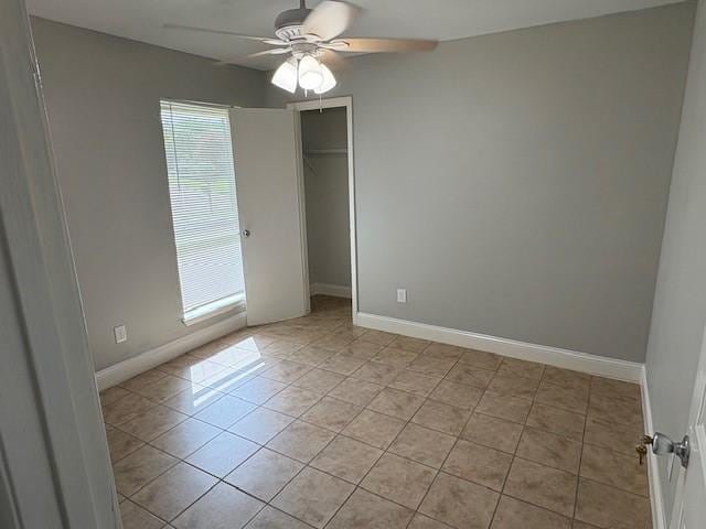 12127 Rhinebeck Dr, Houston, TX 77089 - unfurnished bedroom featuring light tile patterned floors, a closet, and a ceiling fan