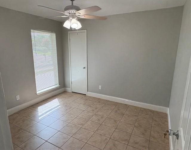 12127 Rhinebeck Dr, Houston, TX 77089 - unfurnished room featuring healthy amount of natural light, ceiling fan, and light tile patterned floors