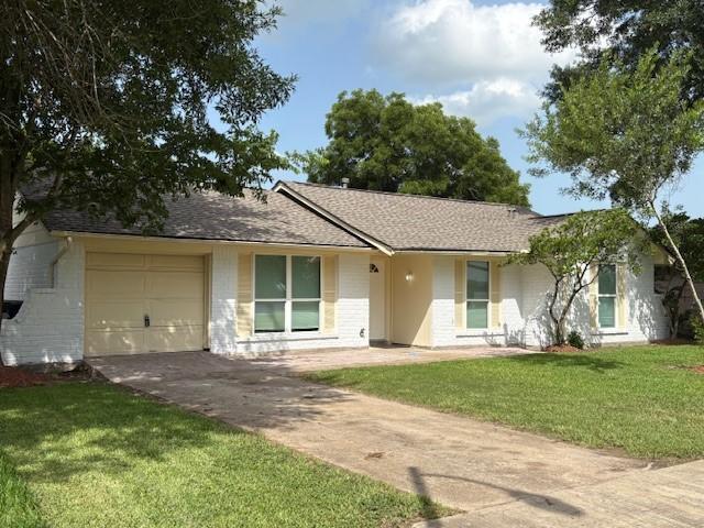 12127 Rhinebeck Dr, Houston, TX 77089 - ranch-style home with driveway, a garage, a front lawn, and roof with shingles