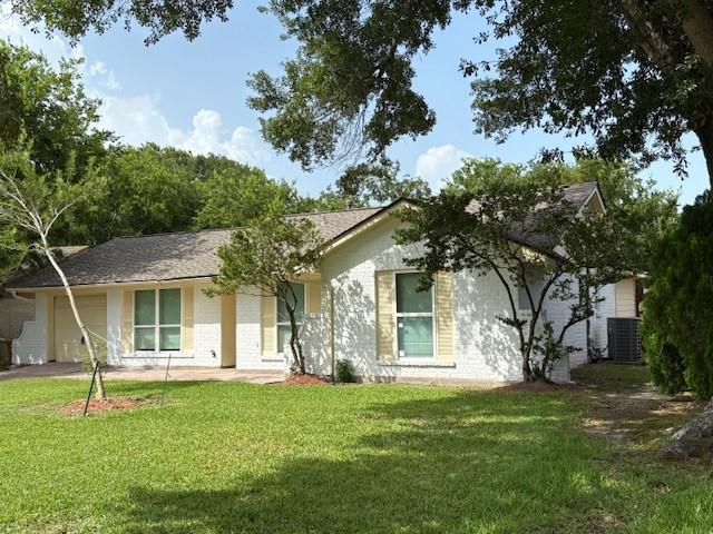 12127 Rhinebeck Dr, Houston, TX 77089 - single story home with an attached garage, a front yard, and asphalt driveway