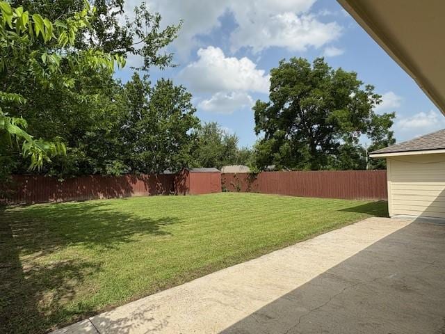 12127 Rhinebeck Dr, Houston, TX 77089 - fenced backyard featuring a storage shed and a patio