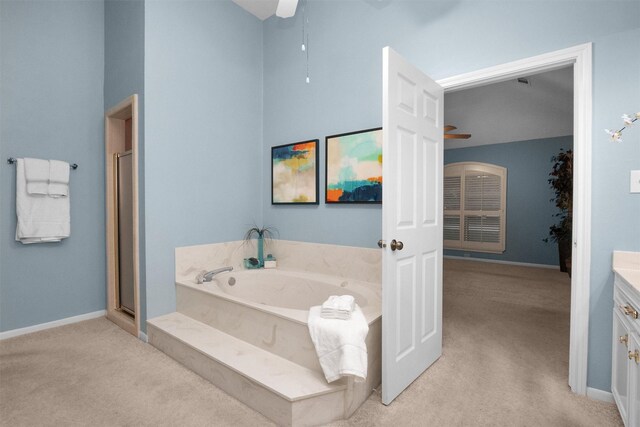 116 April Wind Dr E, Montgomery, TX 77356 - full bath with ceiling fan, vanity, a bath, and carpet floors