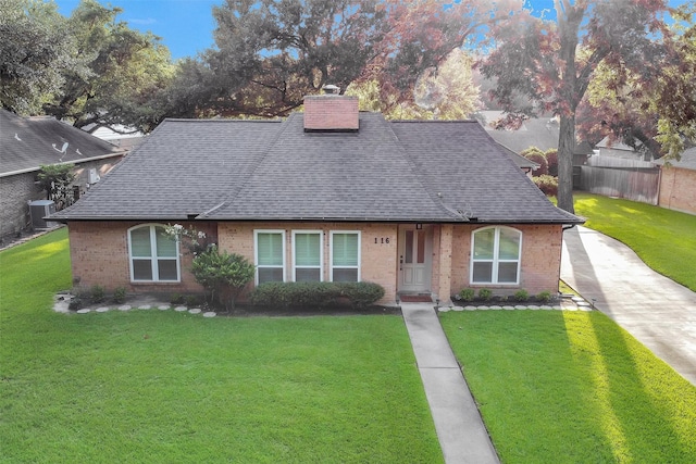 116 April Wind Dr E, Montgomery, TX 77356 - view of front of house featuring roof with shingles, brick siding, a chimney, and concrete driveway