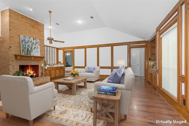 116 April Wind Dr E, Montgomery, TX 77356 - living room featuring a brick fireplace, wood finished floors, a ceiling fan, high vaulted ceiling, and recessed lighting