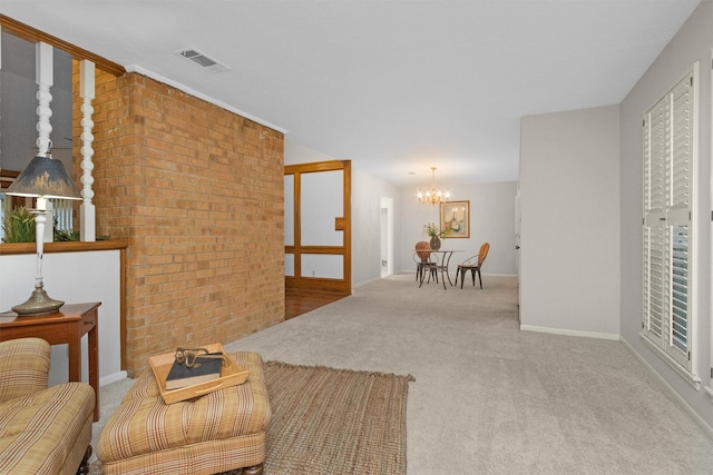 116 April Wind Dr E, Montgomery, TX 77356 - carpeted living area featuring a chandelier and brick wall
