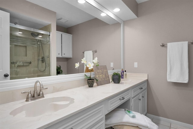 116 April Wind Dr E, Montgomery, TX 77356 - bathroom with double vanity, a stall shower, tile patterned floors, and recessed lighting