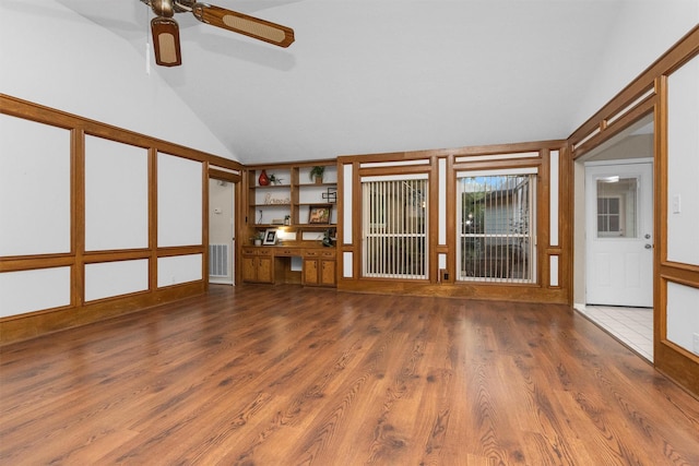 116 April Wind Dr E, Montgomery, TX 77356 - unfurnished living room with lofted ceiling, wood finished floors, and a ceiling fan