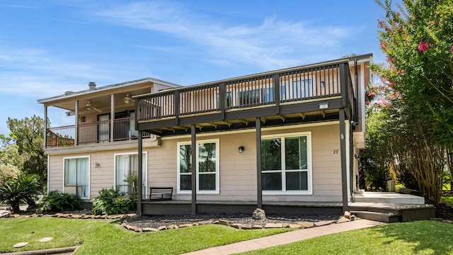 17 Lakeview Vlg, Montgomery, TX 77356 - rear view of house featuring a yard, a balcony, a deck, and a ceiling fan