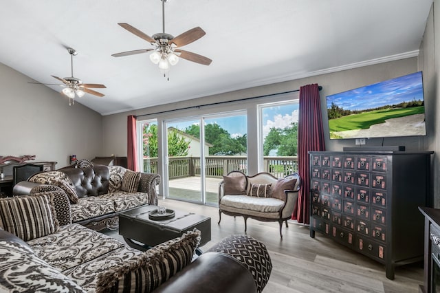 17 Lakeview Vlg, Montgomery, TX 77356 - living room featuring healthy amount of natural light, vaulted ceiling, wood finished floors, crown molding, and ceiling fan