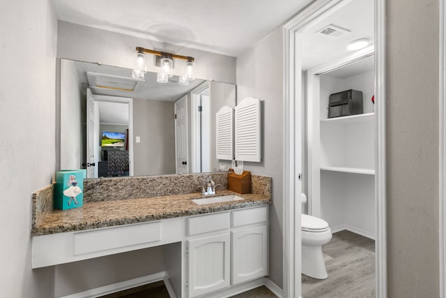 17 Lakeview Vlg, Montgomery, TX 77356 - bathroom featuring vanity, wood finished floors, and a closet