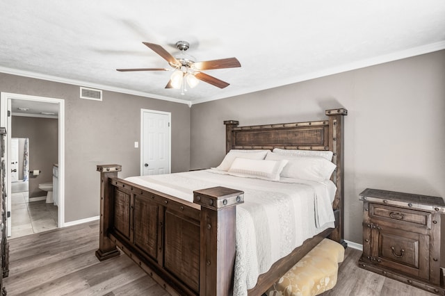 17 Lakeview Vlg, Montgomery, TX 77356 - bedroom with light wood-type flooring, a ceiling fan, crown molding, and ensuite bath