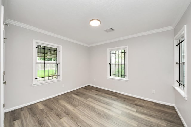 3603 Idaho St, Houston, TX 77021 - spare room featuring crown molding and wood finished floors