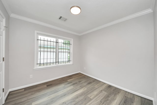 3603 Idaho St, Houston, TX 77021 - spare room featuring wood finished floors and ornamental molding