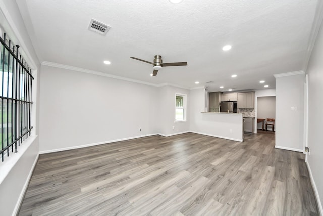 3603 Idaho St, Houston, TX 77021 - unfurnished living room featuring a ceiling fan, wood finished floors, recessed lighting, and ornamental molding