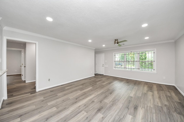 3603 Idaho St, Houston, TX 77021 - spare room featuring recessed lighting, wood finished floors, crown molding, ceiling fan, and a textured ceiling