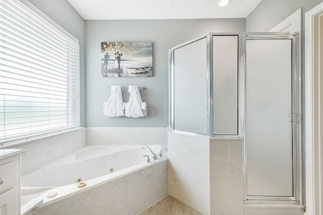 29218 Hay Meadow Ct, Waller, TX 77484 - full bathroom featuring a stall shower, plenty of natural light, and a whirlpool tub