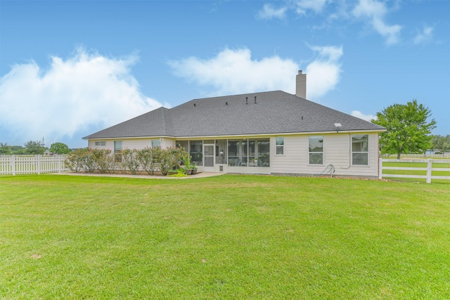 29218 Hay Meadow Ct, Waller, TX 77484 - back of house with a chimney, a sunroom, and roof with shingles