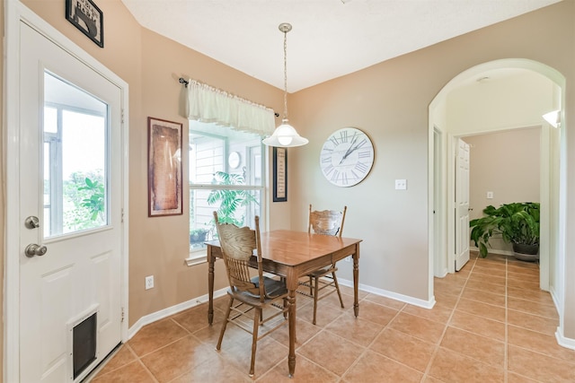 29218 Hay Meadow Ct, Waller, TX 77484 - dining area with light tile patterned floors and arched walkways