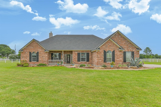 29218 Hay Meadow Ct, Waller, TX 77484 - view of front of property featuring brick siding, a chimney, roof with shingles, and covered porch
