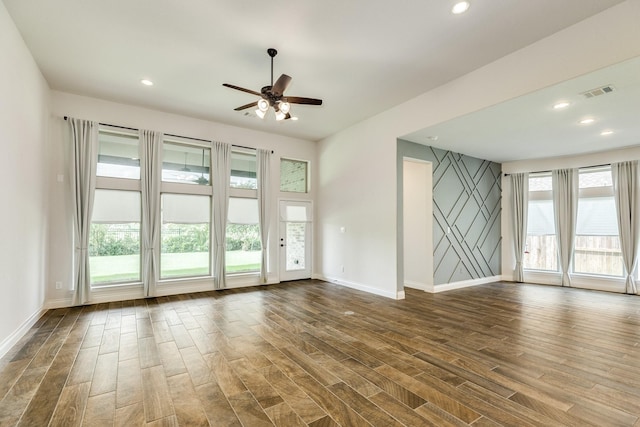 10318 Granite Ct, Iowa Colony, TX 77583 - empty room featuring dark wood-style floors, a ceiling fan, and recessed lighting