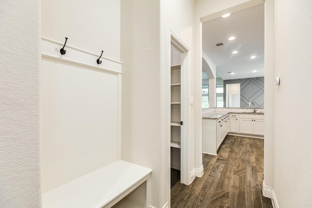 10318 Granite Ct, Iowa Colony, TX 77583 - mudroom featuring dark wood-type flooring, recessed lighting, and arched walkways