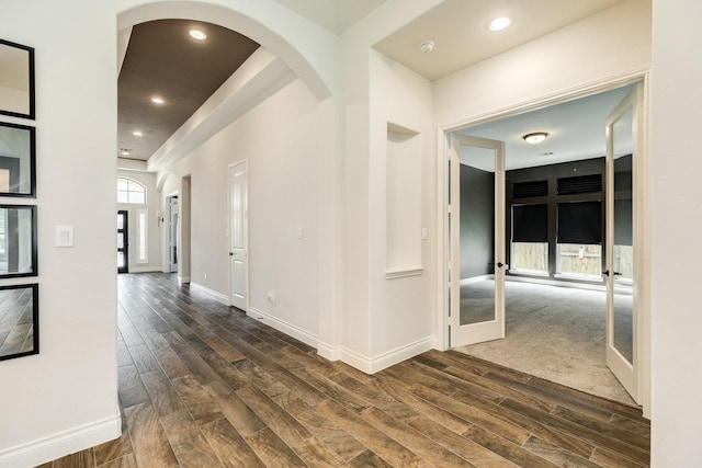 10318 Granite Ct, Iowa Colony, TX 77583 - hall with dark wood-style flooring, french doors, arched walkways, and recessed lighting