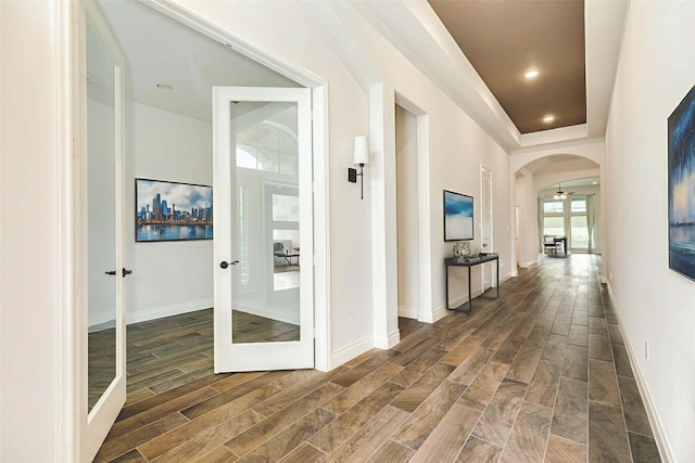 10318 Granite Ct, Iowa Colony, TX 77583 - hallway featuring arched walkways, wood finished floors, recessed lighting, and french doors