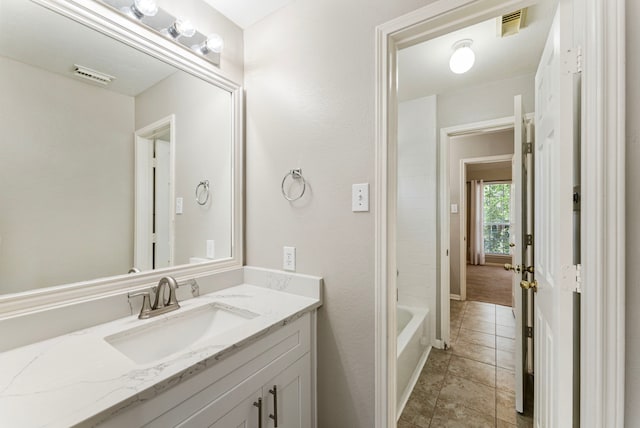 53 Silver Crescent Ct, The Woodlands, TX 77382 - full bath with vanity, a bath, and tile patterned flooring