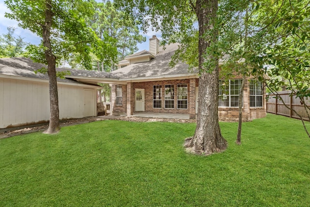 53 Silver Crescent Ct, The Woodlands, TX 77382 - rear view of property with brick siding, a chimney, roof with shingles, and a patio area