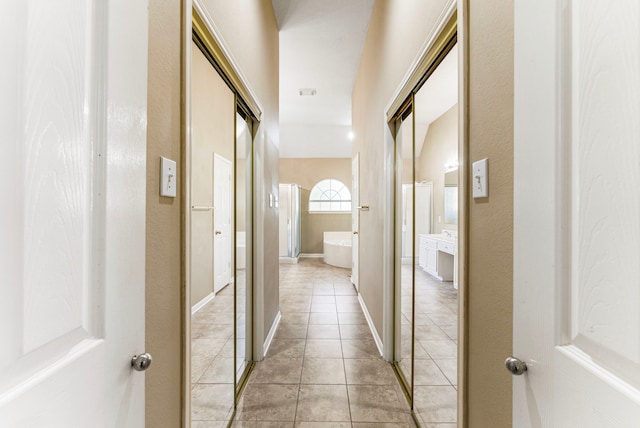 53 Silver Crescent Ct, The Woodlands, TX 77382 - hallway with light tile patterned flooring