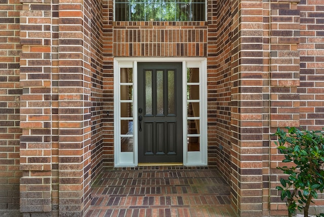 53 Silver Crescent Ct, The Woodlands, TX 77382 - doorway to property featuring brick siding