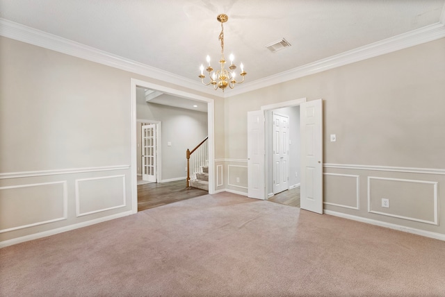 53 Silver Crescent Ct, The Woodlands, TX 77382 - carpeted spare room with a chandelier, ornamental molding, a decorative wall, and stairway