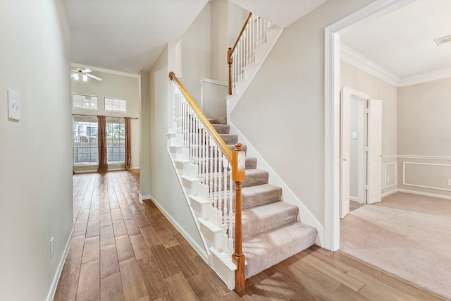 53 Silver Crescent Ct, The Woodlands, TX 77382 - staircase with wood finished floors, ceiling fan, and crown molding