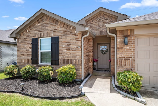 1618 William Scott St, Baytown, TX 77523 - view of exterior entry with brick siding and a shingled roof