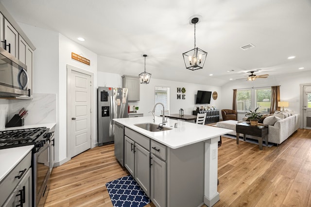 1618 William Scott St, Baytown, TX 77523 - kitchen with stainless steel appliances, gray cabinetry, recessed lighting, light countertops, and open floor plan