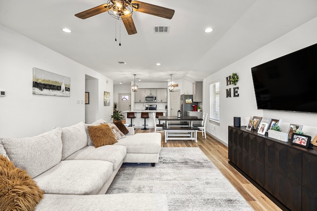 1618 William Scott St, Baytown, TX 77523 - living room featuring a ceiling fan, light wood-style flooring, and recessed lighting