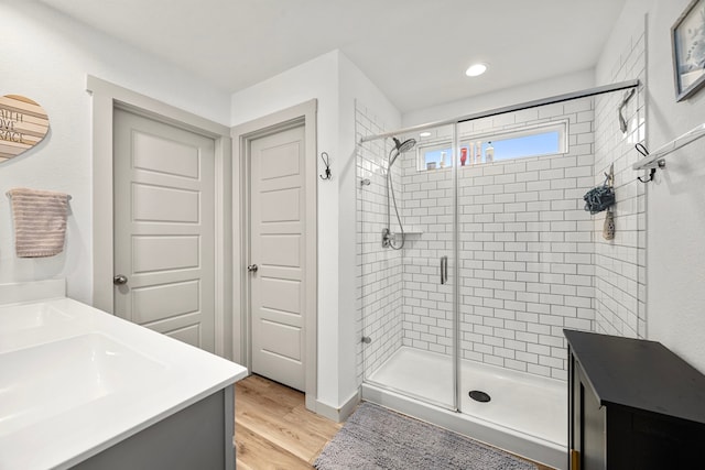 1618 William Scott St, Baytown, TX 77523 - bathroom with a stall shower, wood finished floors, vanity, and recessed lighting