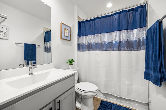 1618 William Scott St, Baytown, TX 77523 - bathroom featuring vanity, wood finished floors, and shower / bathtub combination with curtain