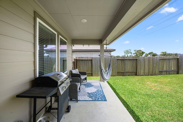 1618 William Scott St, Baytown, TX 77523 - fenced backyard with grilling area and a patio