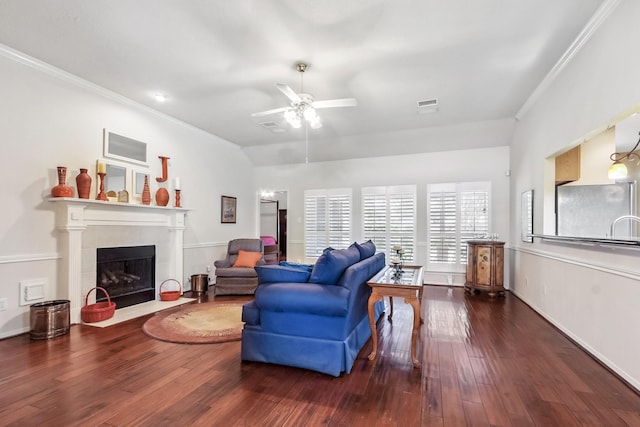 15407 Copper Branch Ln, Houston, TX 77095 - living room with wood finished floors, a ceiling fan, crown molding, and a fireplace