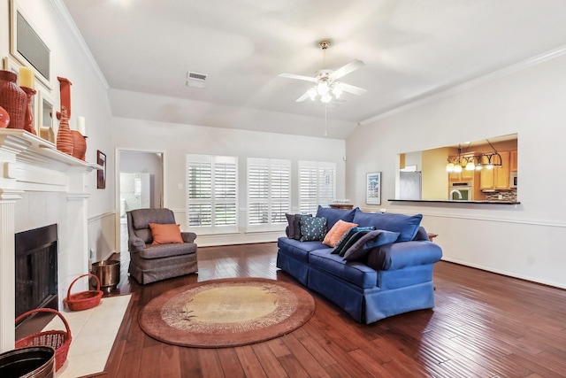 15407 Copper Branch Ln, Houston, TX 77095 - living area featuring crown molding, hardwood / wood-style floors, a ceiling fan, lofted ceiling, and a fireplace