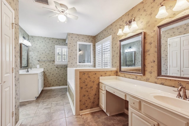 15407 Copper Branch Ln, Houston, TX 77095 - full bathroom featuring a bath, two vanities, a ceiling fan, wallpapered walls, and tile patterned flooring
