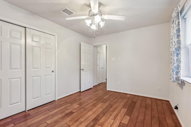15407 Copper Branch Ln, Houston, TX 77095 - unfurnished bedroom with light wood-style flooring, a closet, and a ceiling fan