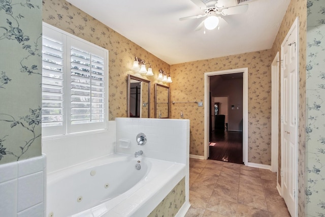 15407 Copper Branch Ln, Houston, TX 77095 - full bath with a jetted tub, a ceiling fan, and tile patterned floors