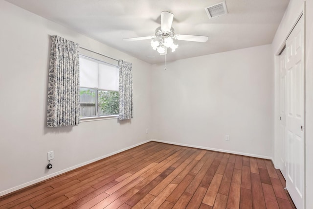 15407 Copper Branch Ln, Houston, TX 77095 - unfurnished bedroom with a closet, wood finished floors, and a ceiling fan